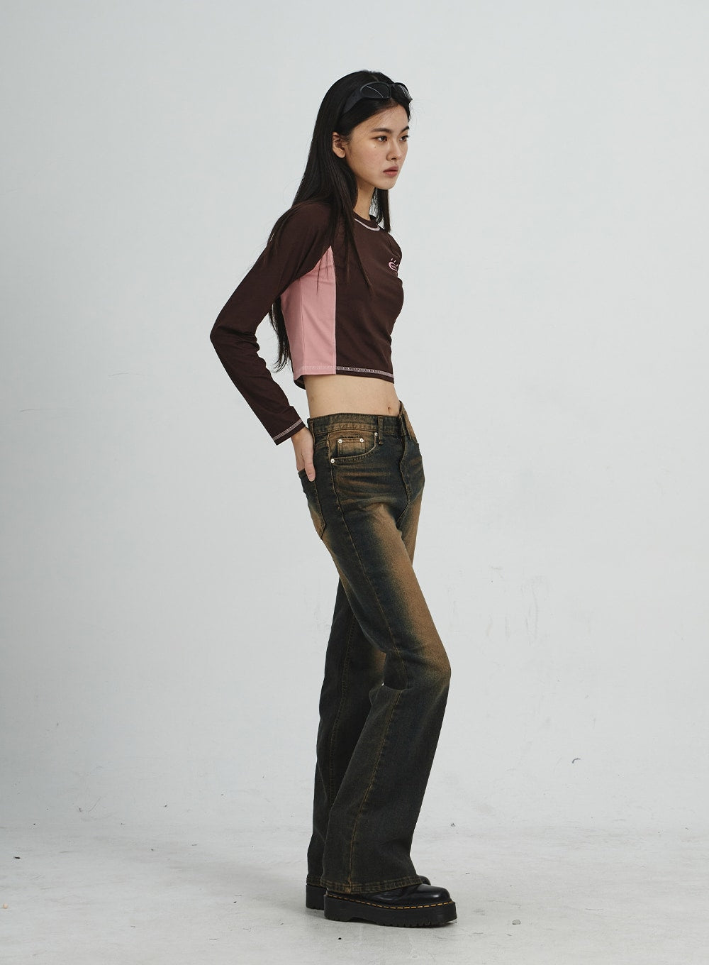 Vintage Washing Bootcut Jeans CD02 in dark washed denim, full-length side view on model, profile pose showing slim hip-to-thigh fit, bootcut flare and heavy amber vintage wash gradient.