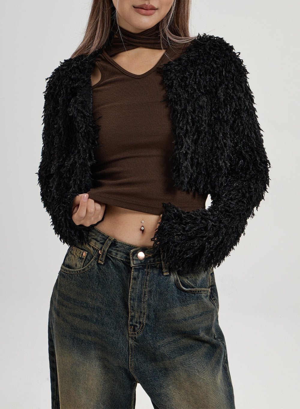 Vintage Washing Wide Leg Denim Pants CN14 in vintage washed indigo, waist close-up on model, showing button fly, front pockets with yellow-brown vintage wash fading and wide-fit waistband detail.