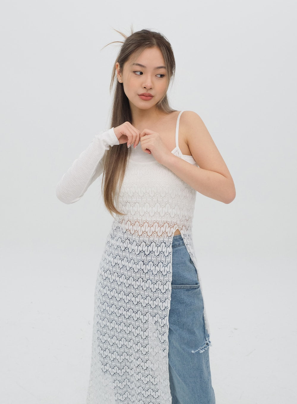 Torn Wide Leg Jeans C1002 in light blue, upper-body-focused front shot on model, ripped side detail and wide waistband glimpsed under white lace dress, styled look.