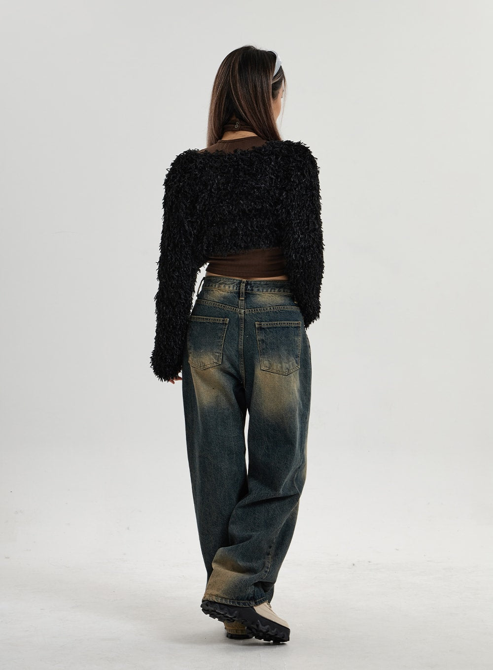 Vintage Washing Wide Leg Denim Pants CN14 in vintage washed indigo, full-body back view on model walking, showing back patch pockets, heavy yellow-brown vintage wash, and wide leg hem on cotton denim.