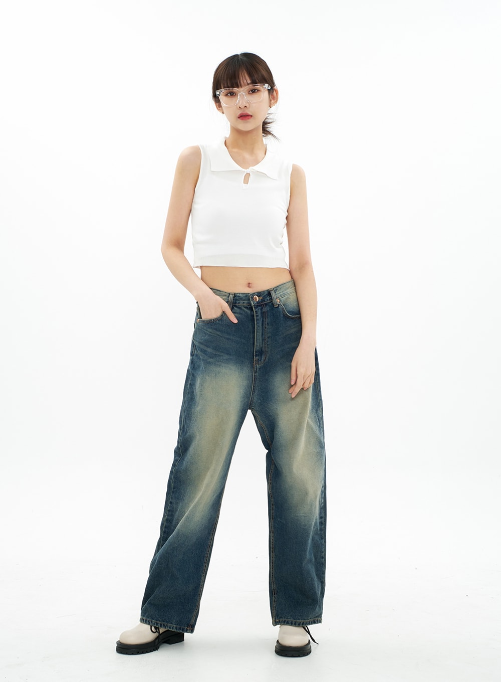 Bleached Wide Leg Denim Pants CA07 in vintage blue, full-body front view on model with relaxed stance, one hand in pocket, long wide-leg cotton denim with visible bleached wash gradient.