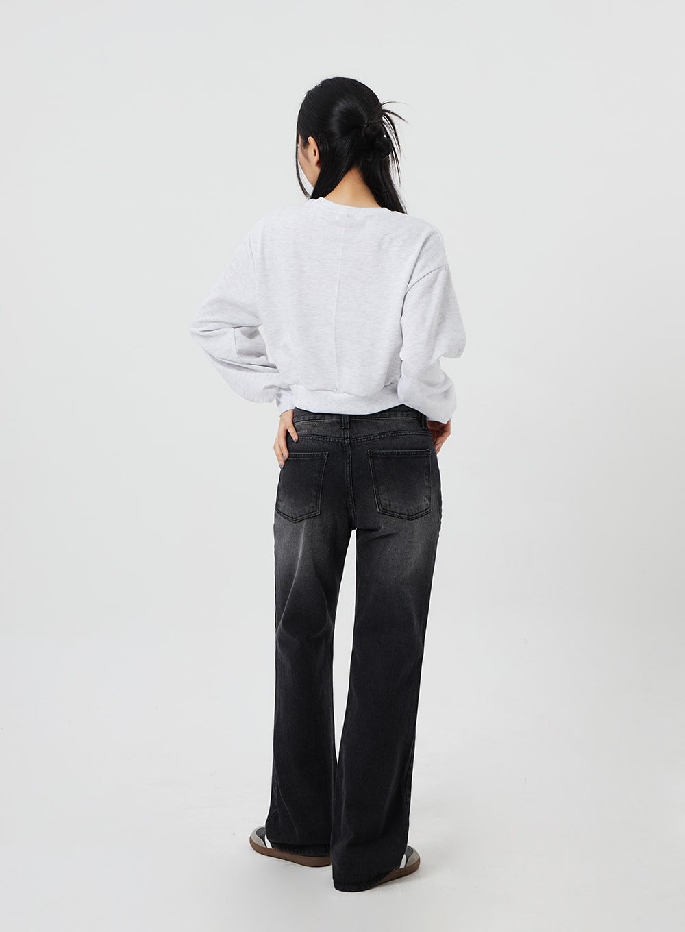 Mid-Rise Bootcut Jeans CF327 in black, full back view on model, back patch pockets and faded wash detail visible, bootcut hem shown, paired with grey crop sweatshirt.