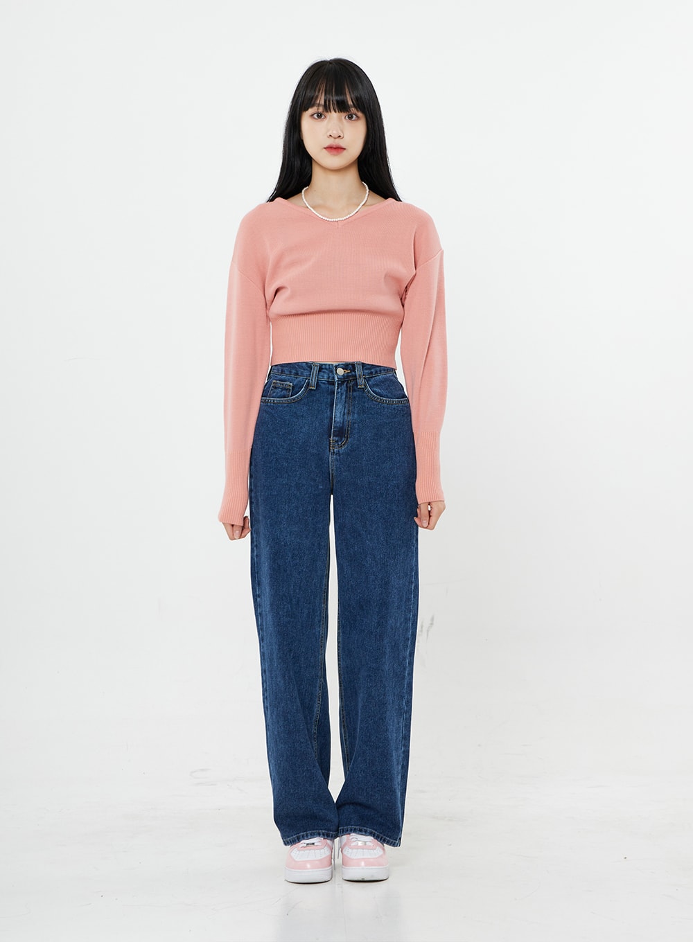Basic Long Denim Pants BS28 in mid-blue, front full-length on model standing straight, high-rise straight wide-leg cotton denim with clean silhouette, pink crop knit and sneakers.