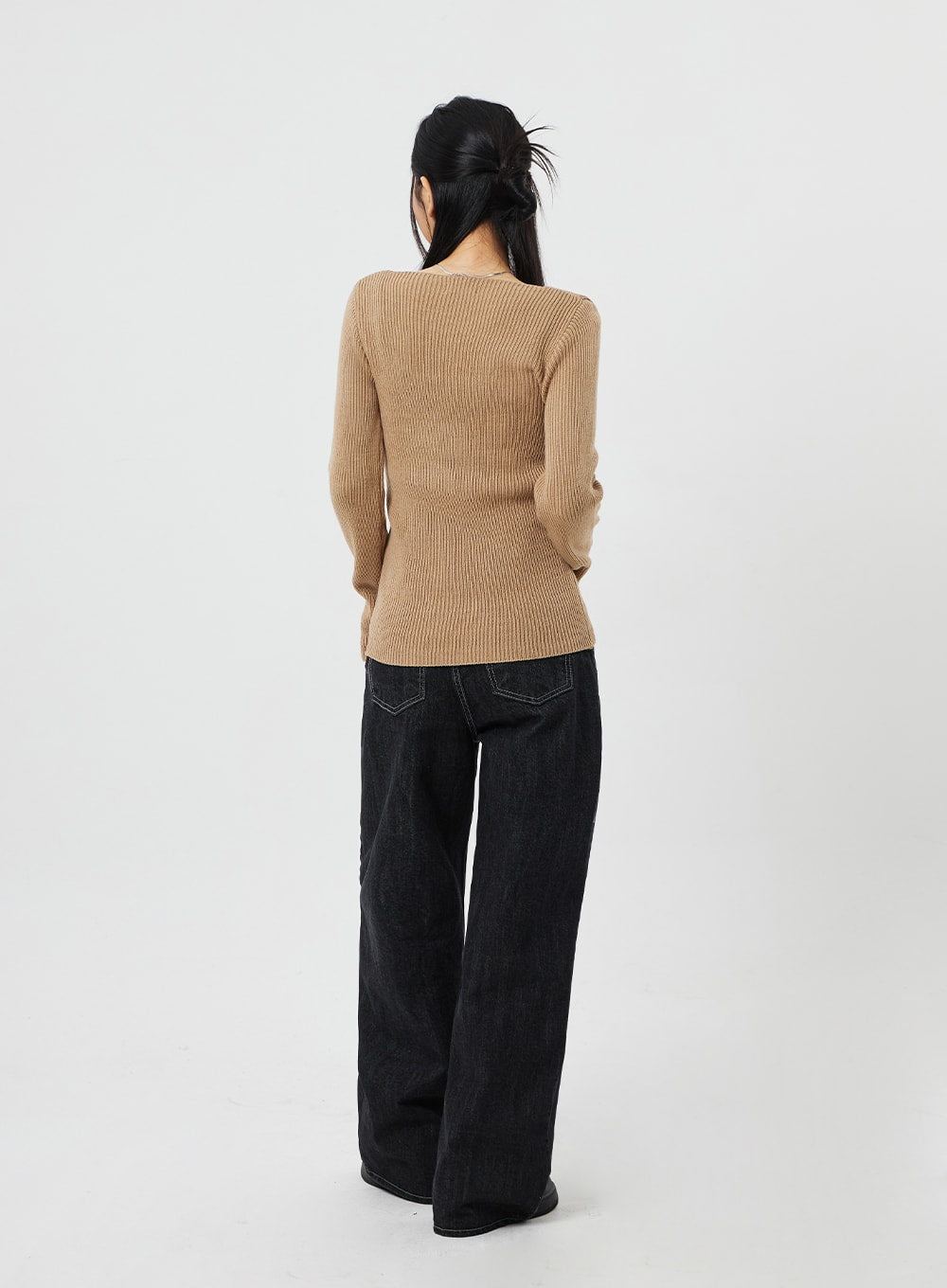 Straight Leg Jeans CF315 in black, full-body back view on model, wide-fit straight-leg cotton denim with back pockets and contrast topstitching, styled with camel ribbed knit.