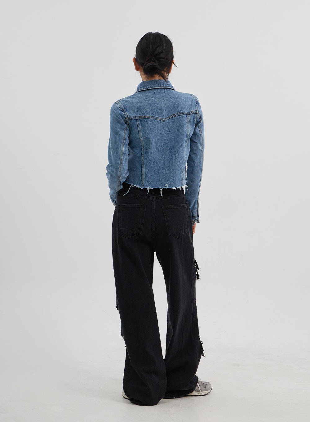 Ripped Wide Leg Jeans CJ319 in black, full-length back view on model, rear pockets and side frayed rip distressing visible, wide-leg silhouette in black washed cotton denim.