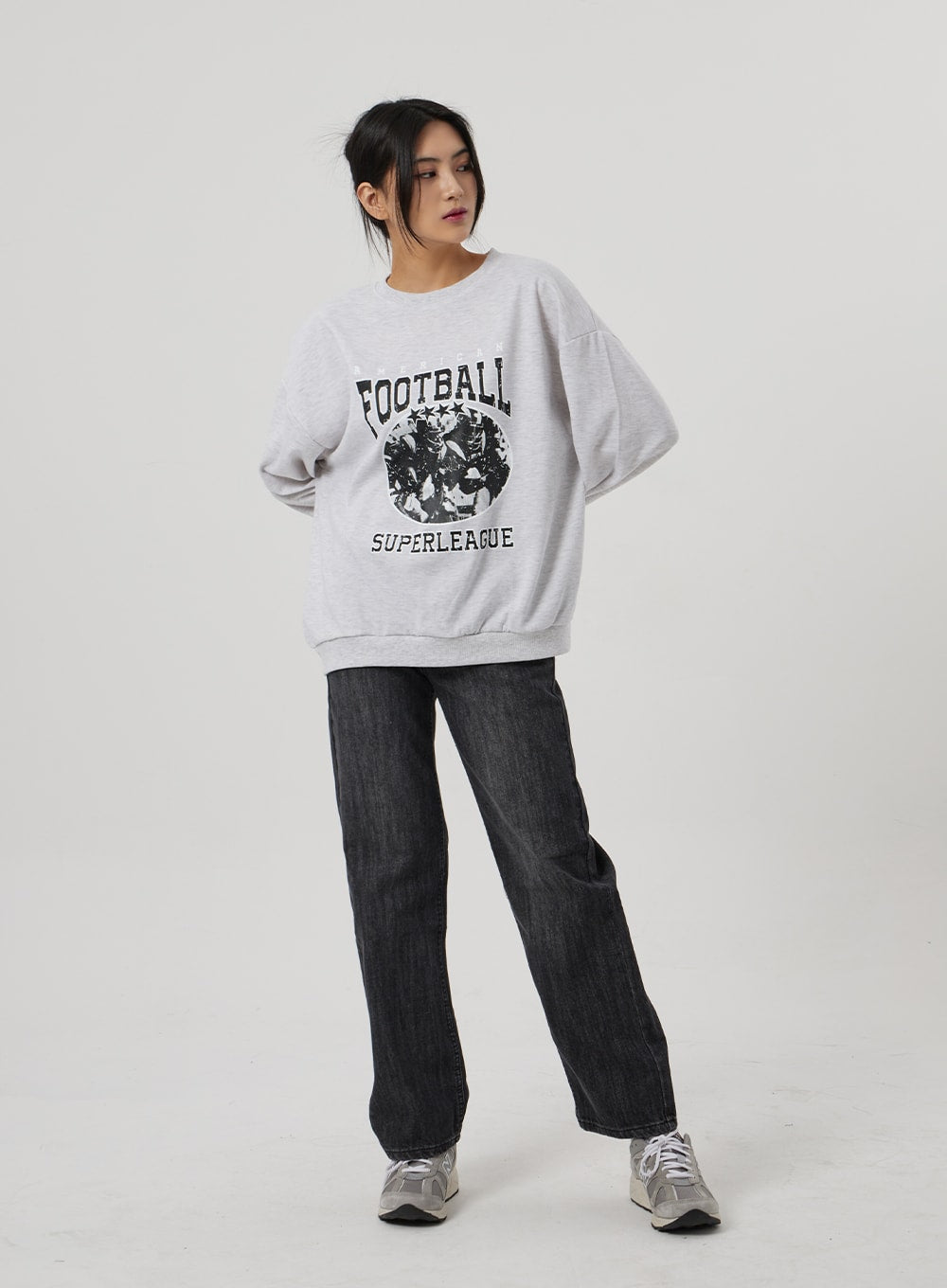 Wide Straight Leg Jeans BF310 in washed black, full-length front view on model looking down, wide straight leg cotton denim with easy casual drape, styled with oversized grey sweatshirt.