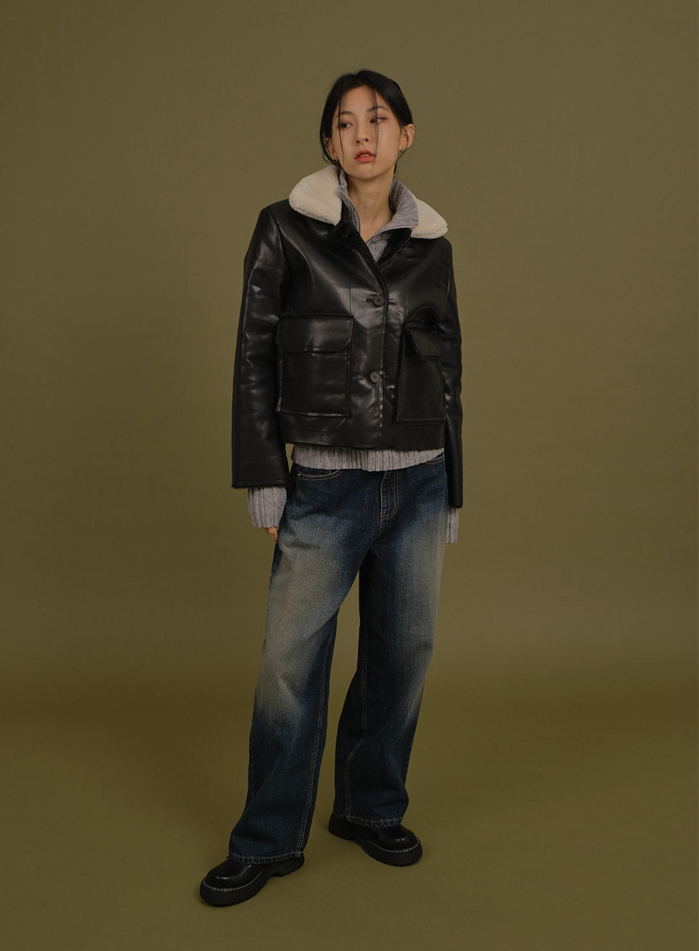 Washed Wide Denim Pants in blue, full-body front shot on model, relaxed straight wide leg with washed gradation denim, paired with black leather jacket and grey knit top.