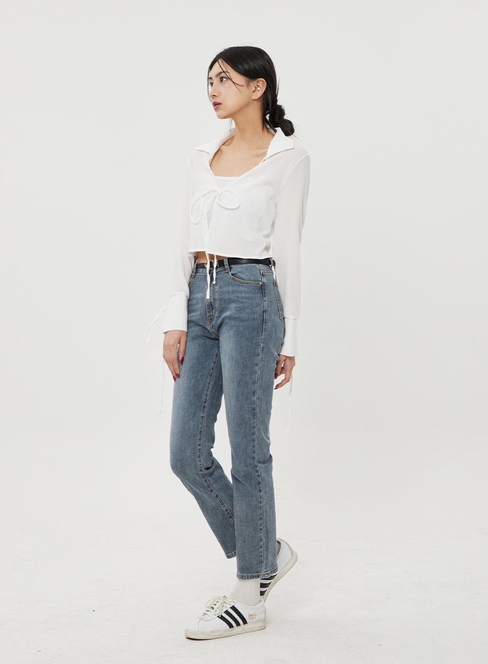 Straight Leg Ankle Jeans BF316 in mid-blue wash, side view on model, slim straight cut showing ankle length hem and high-rise waist, paired with white cropped top and sneakers.