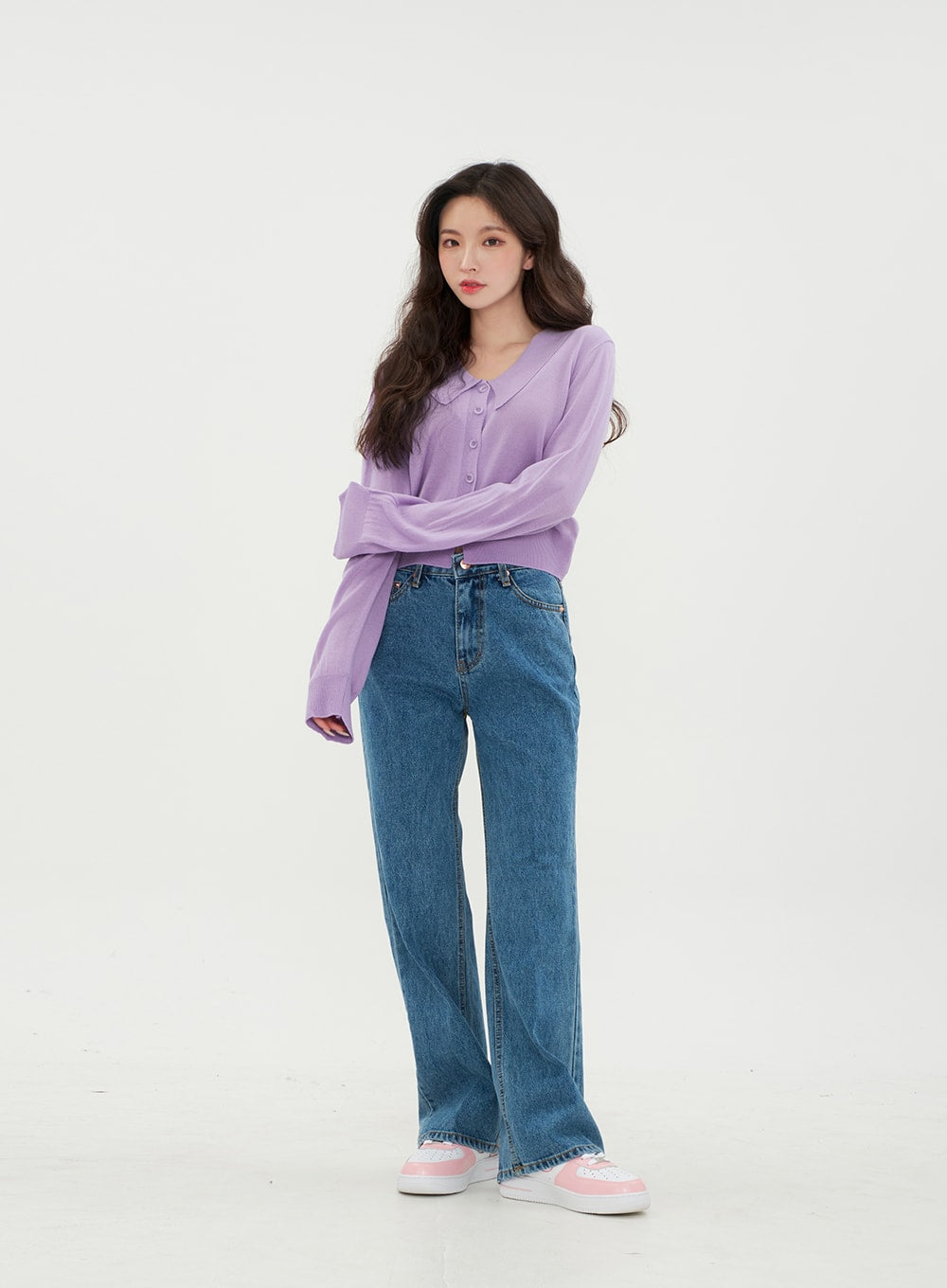Semi Wide Jeans BM21 in mid-blue denim, front full-body on model with relaxed stance, long wide-fit solid denim with side pockets visible, styled with lavender cropped knit top.