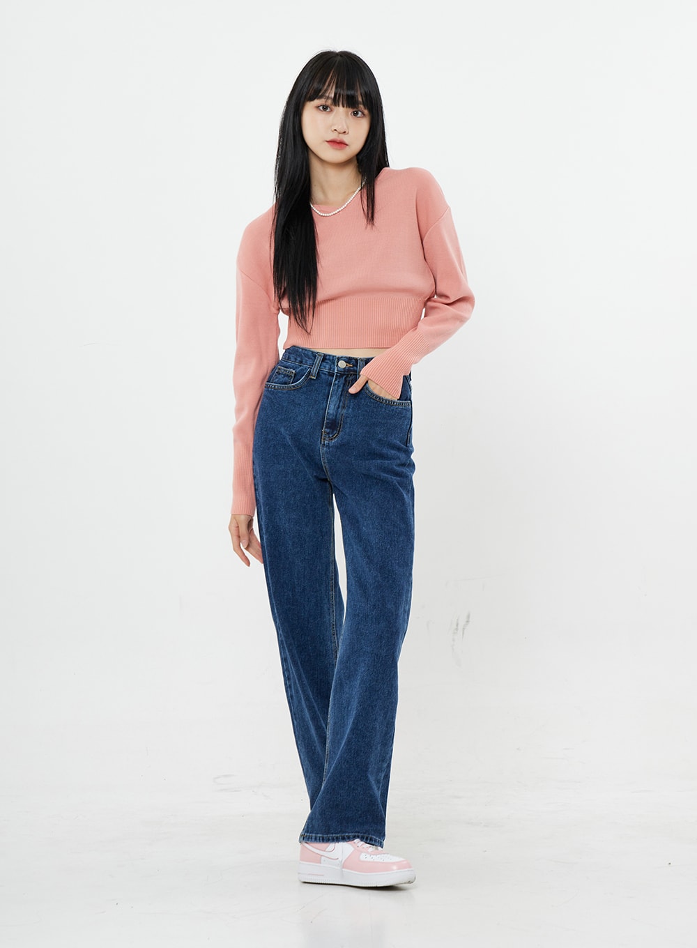 LEWKIN Basic Long Denim Pants BS28 in mid-blue, front full-body on model, straight-fit high-rise cotton denim with wide leg, paired with pink crop knit and sneakers.