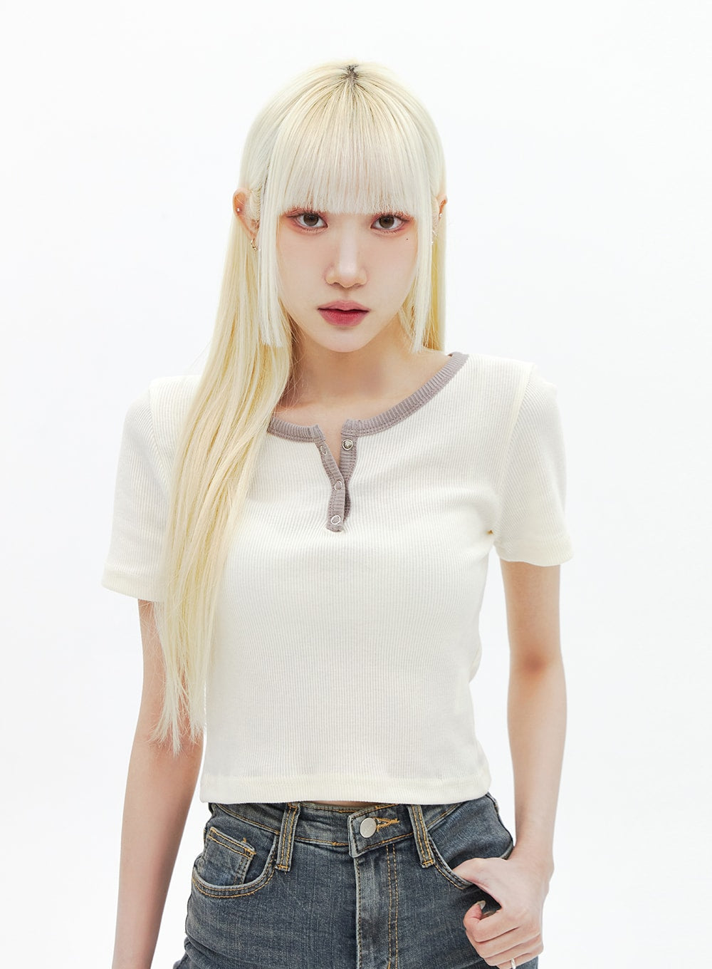 Dark Wash Bootcut Jeans BA320 in dark blue, upper-waist crop shot on model, high-rise front pockets and silver button closure visible, washed slim-fit denim.