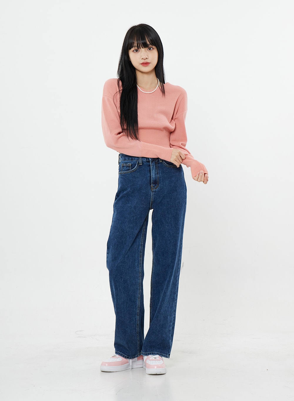 Basic Long Denim Pants BS28 in mid-blue, front full-length on model with relaxed stance, straight-fit wide-leg high-rise denim, paired with pink ribbed crop knit and sneakers.