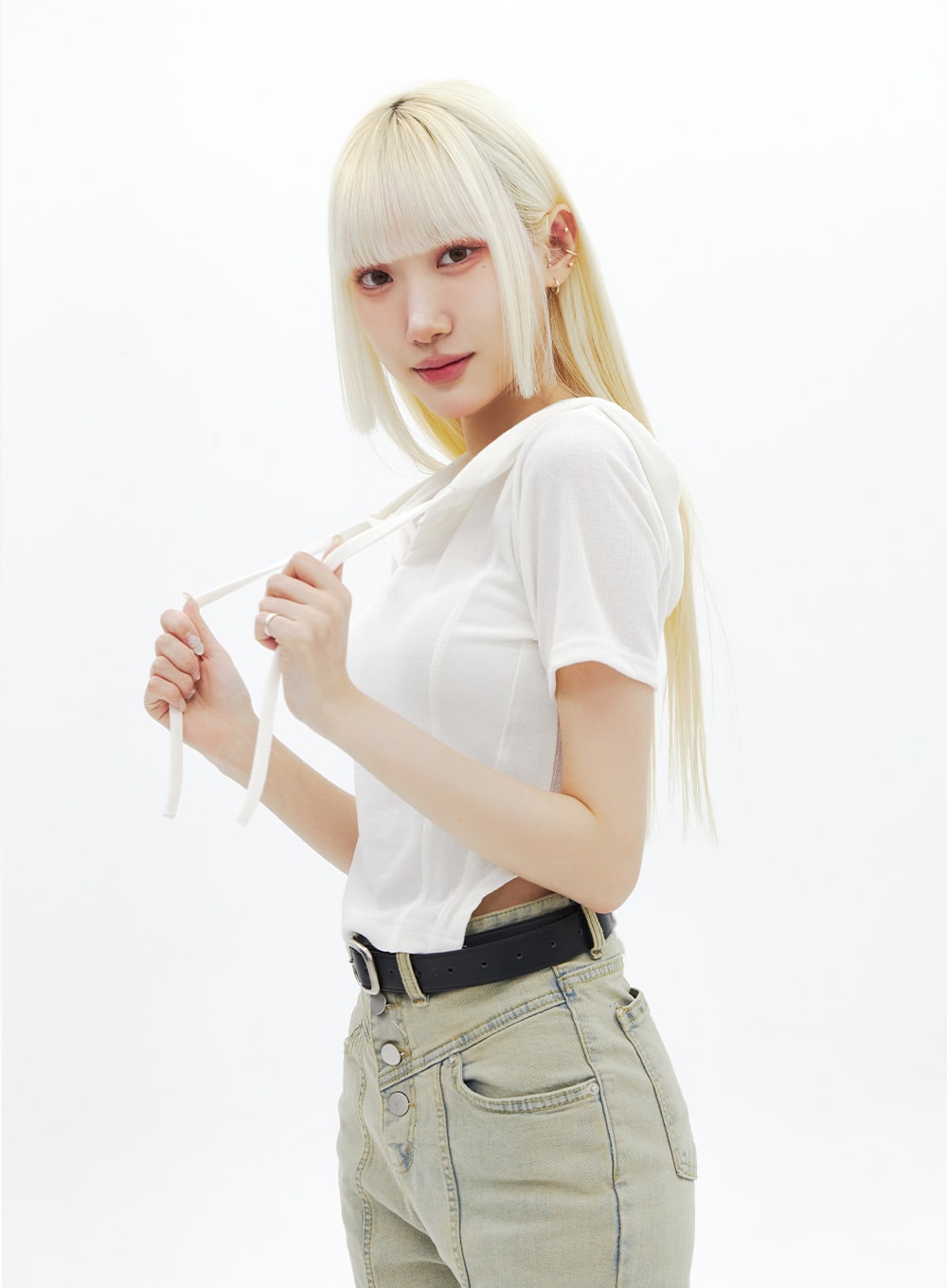 Beige Wash Bootcut Jeans BA320 in beige, upper-body side close-up on model, showing high-rise waistband, triple button fly side angle, and washed denim texture with black belt.