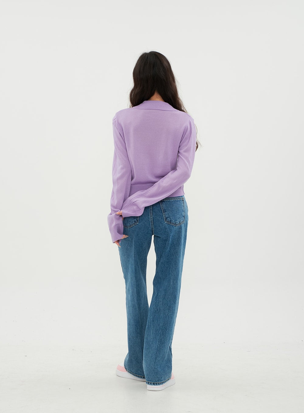 Semi Wide Jeans BM21 in mid-blue denim, back full-body on model standing, showing dual back pockets and wide-leg silhouette in solid cotton denim, paired with purple long-sleeve top.