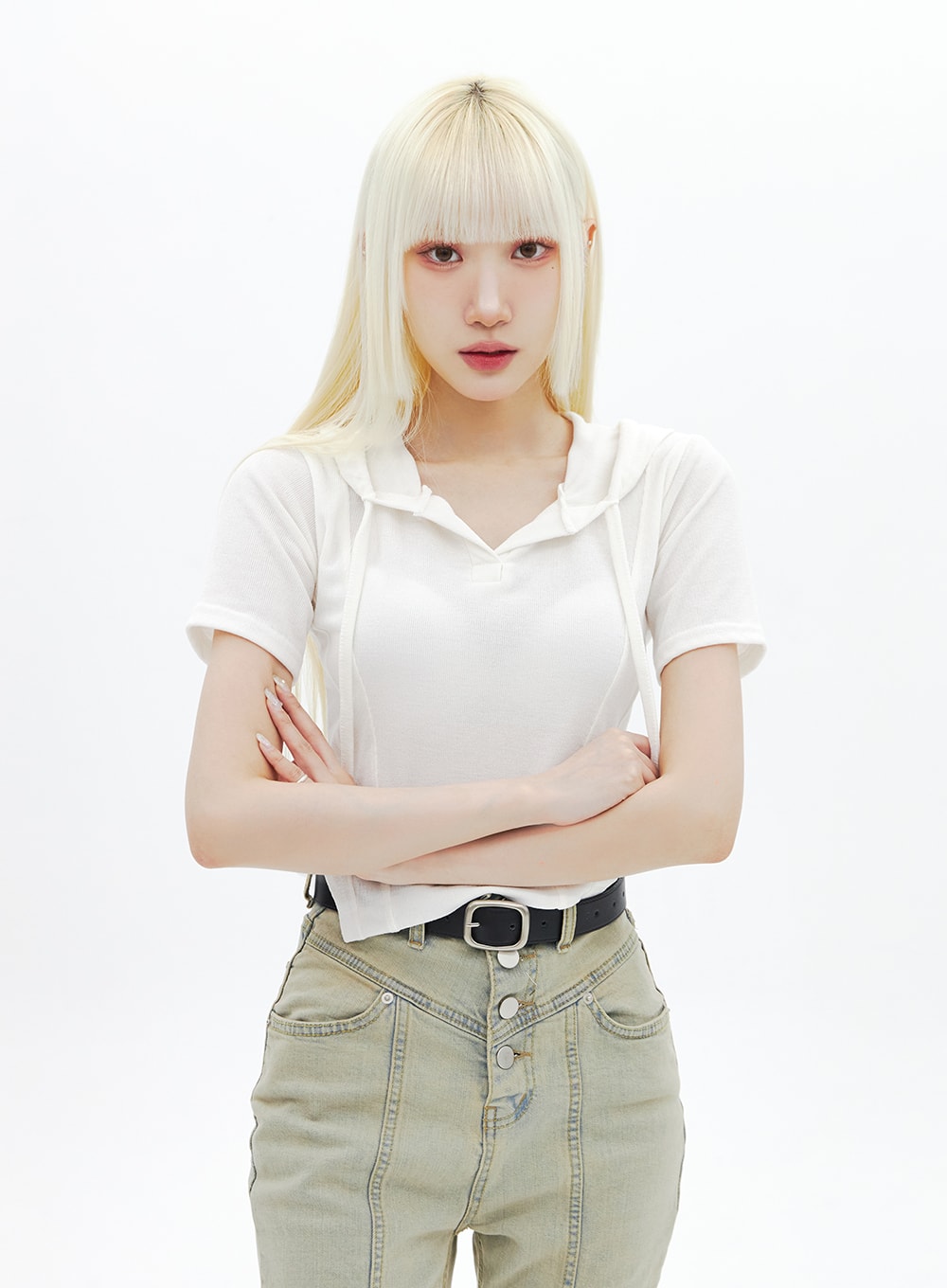 Beige Wash Bootcut Jeans BA320 in beige, waist-up front close-up on model with arms crossed, highlighting V-yoke triple button fly and high-rise waist detail, paired with white hoodie tee.