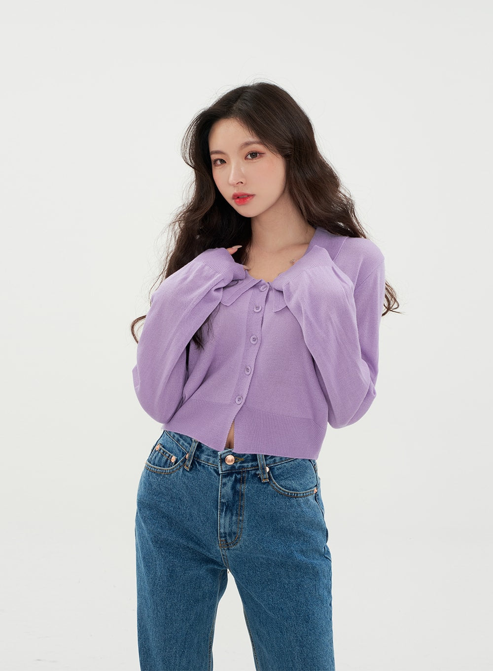 Semi Wide Jeans BM21 in mid-blue denim, front waist-up close-up on model, high-rise waistband with button and zip-up closure detail visible, paired with purple peter-pan collar cardigan.
