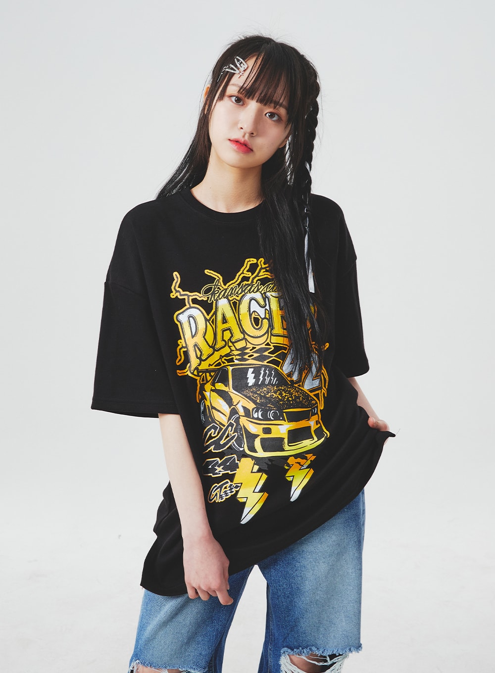 Ripped Knee Blue Jeans BA307 in blue, upper-thigh crop shot on model, wide-fit ripped knee denim with frayed destroyed cutout visible, paired with black oversized racer tee.