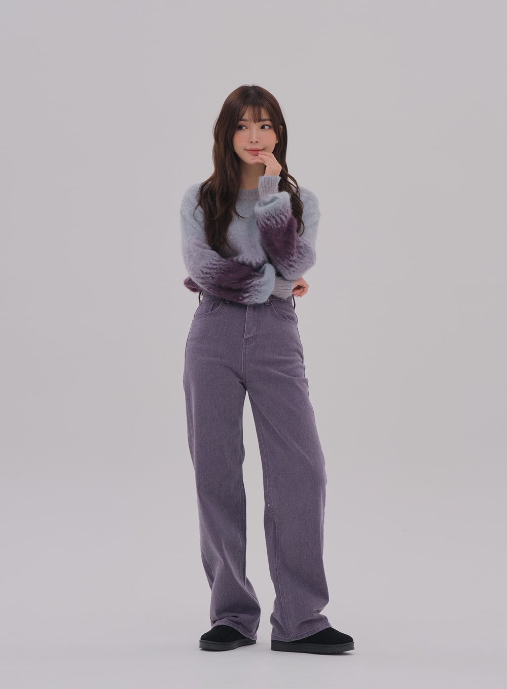 Wide Leg Color Jeans BS-A0812026 in purple, front full-length on model with hand-to-chin pose, high-waist wide-fit cotton denim, front pockets visible, styled with fluffy gradient sweater.