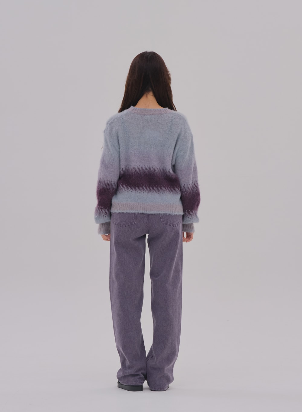 Wide Leg Color Jeans BS-A0812026 in purple, back full-length on model, high-waist wide-fit cotton denim, back pockets and wide straight-leg silhouette clearly shown, paired with gradient sweater.