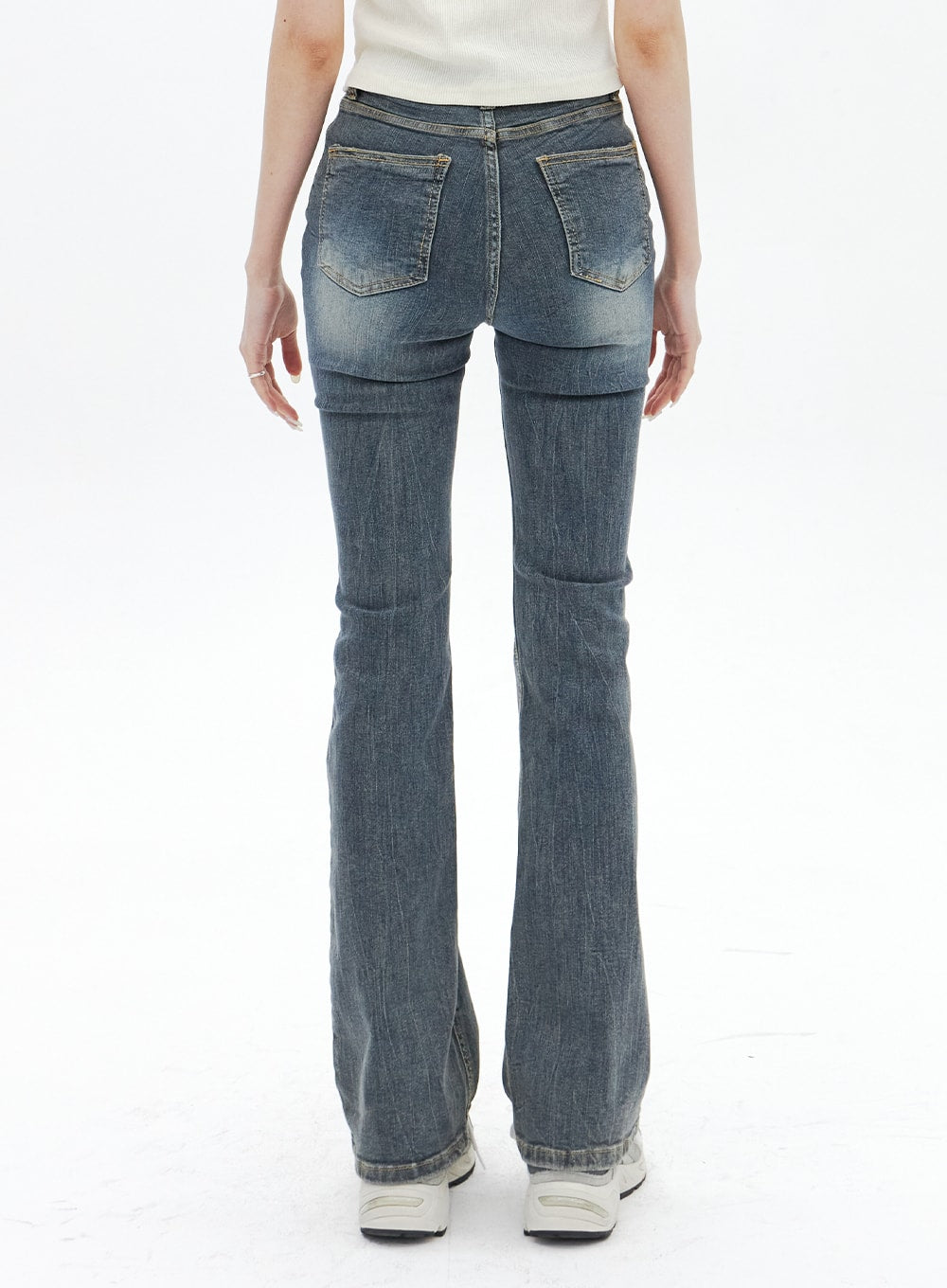 Dark Wash Bootcut Jeans BA320 in dark blue, back view on model, two back patch pockets with washed fading, slim-fit bootcut flare from knee down, casual denim styling.