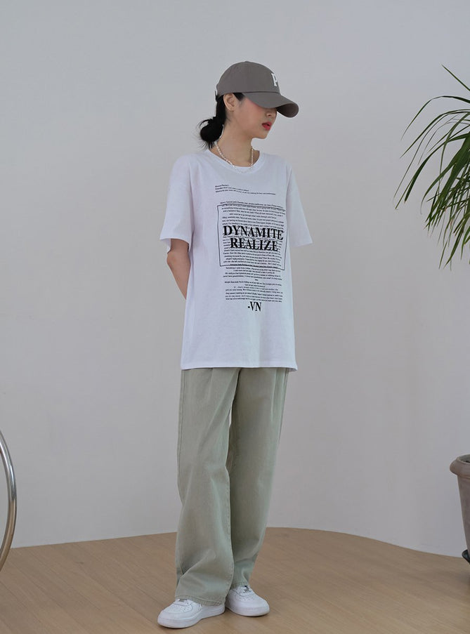 LEWKIN Baseball Cap with Logo Print CM03 in grey, full-body front view on model, cotton baseball cap with embroidered P logo, worn with graphic tee and sage wide-leg trousers.
