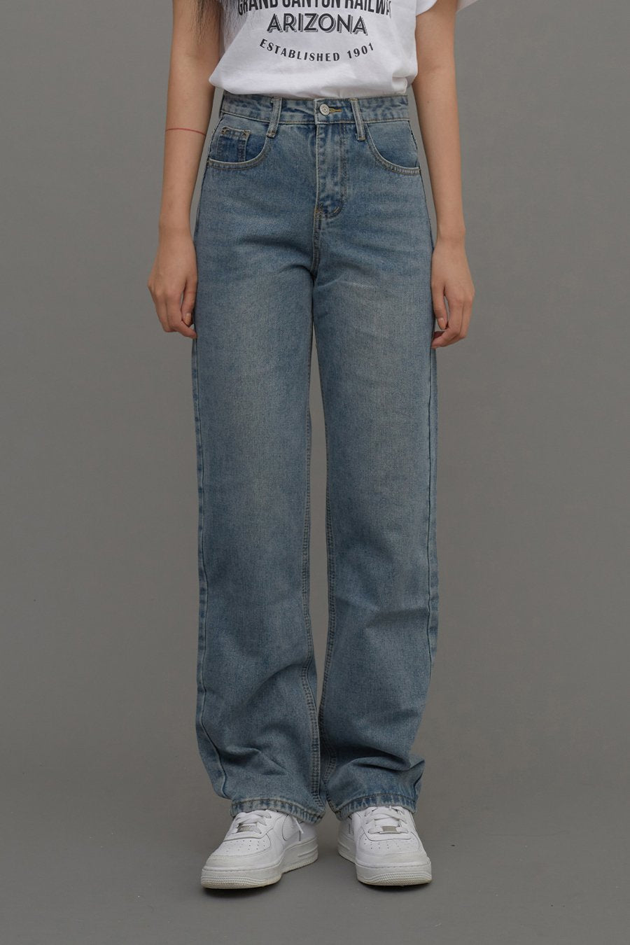 Straight Leg Jeans CM6 in Blue Denim, front waist-to-hem crop shot on model, high-rise waistband with button fly and side pockets visible, long straight leg length.